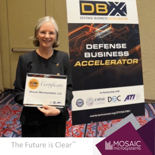 Shelby Nelson of Mosaic Microsystems accepts DBX Award